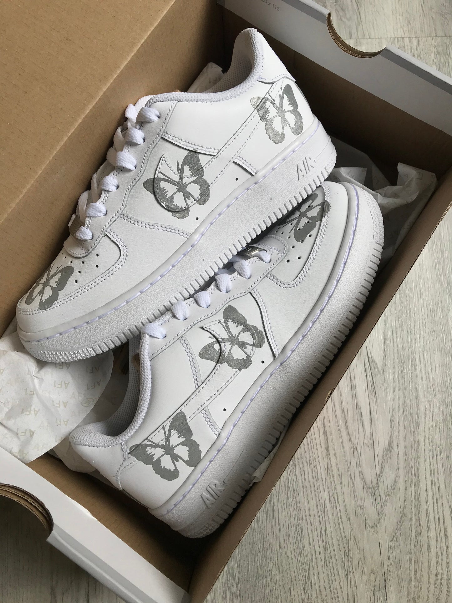 Hand-painted custom sneakers with abstract design by VK Customs